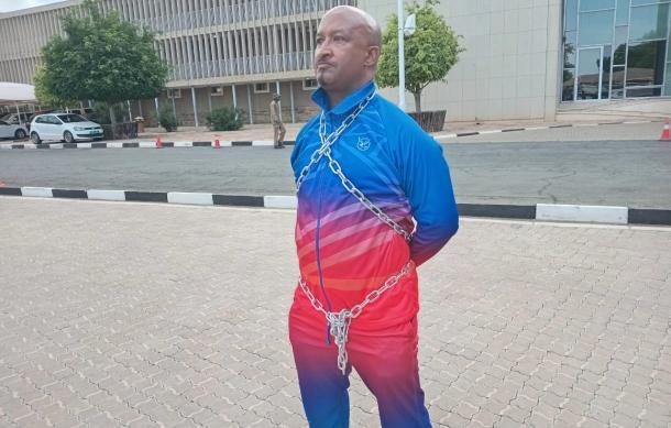 OPM employee protests in chains over reinstatement dispute